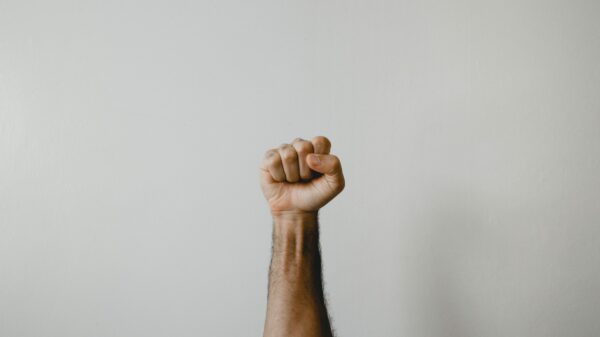 persons right foot on white wall