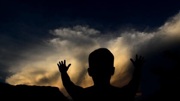 silhouette man looking at the sky