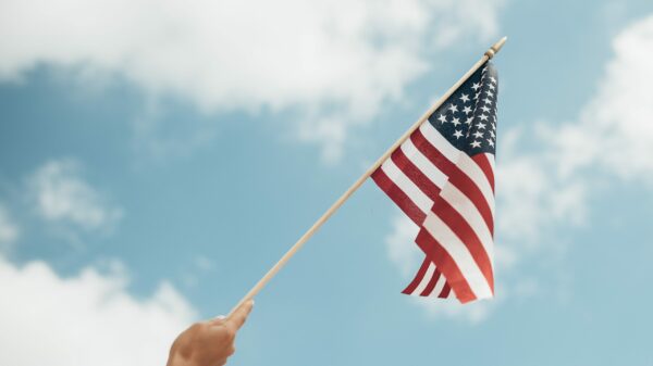 person holding U.S.A. flag