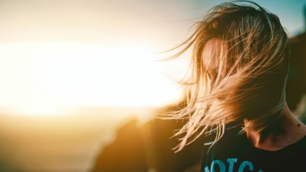 woman standing on cliff