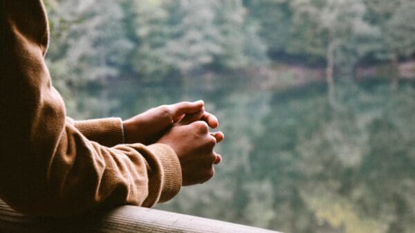 tilt-shift photography of person in brown jacket